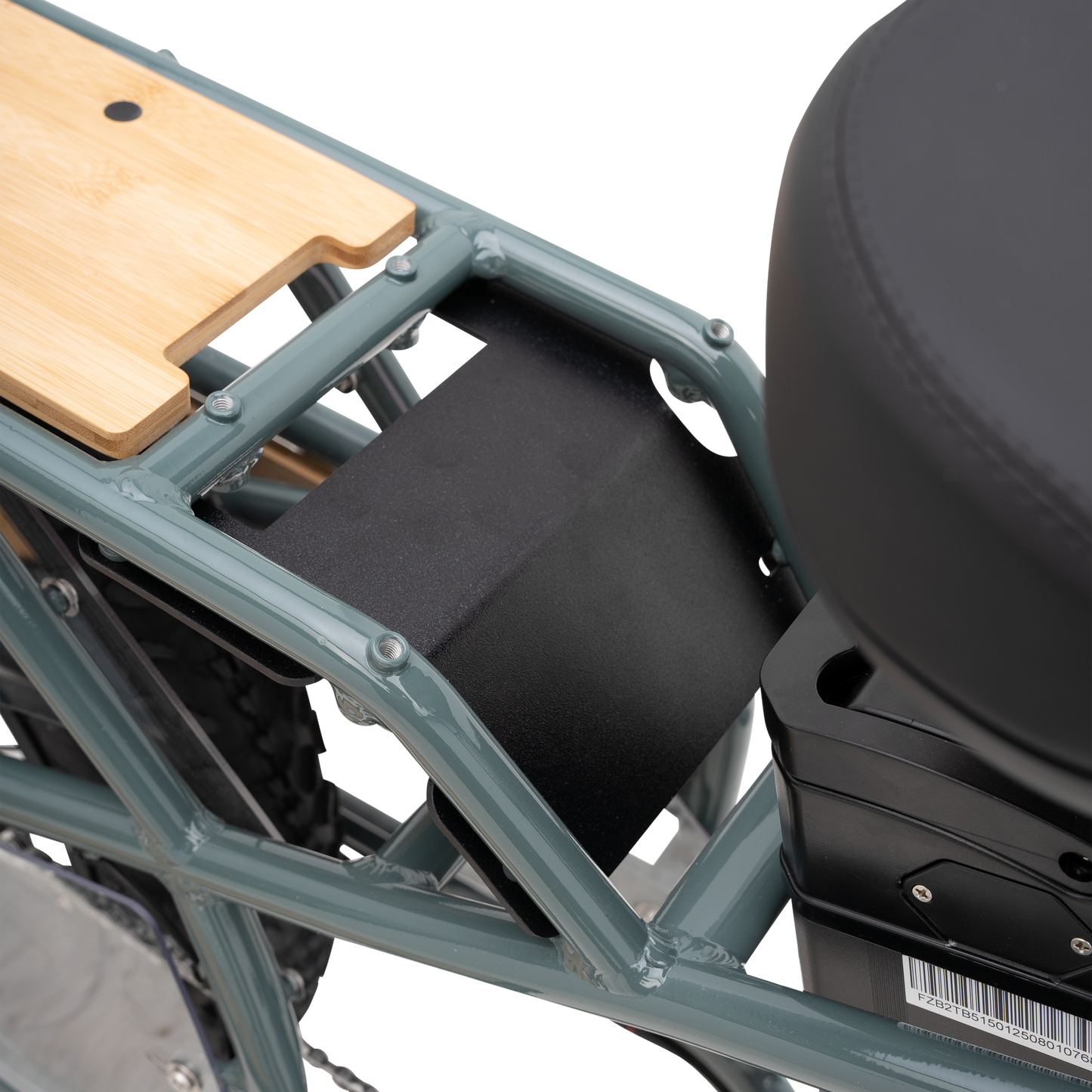 Close-up of the rear cargo platform and protectiveplate integrated with frame separating the rider seat from the rear platform with a wooden bamboo inlayed board