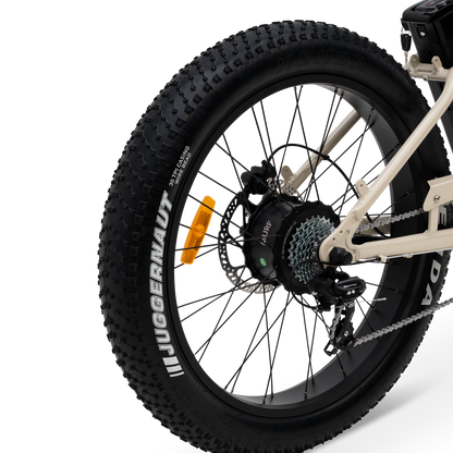 Close-up of a bicycle rear wheel hub mounted motor with a white background