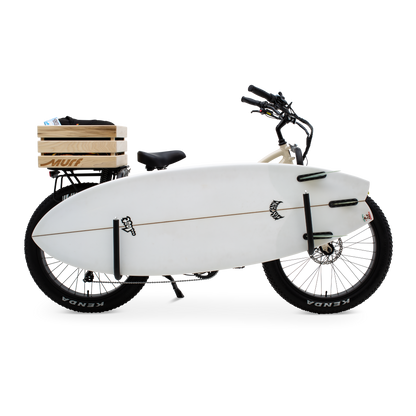  The Fat Murf Step-Thru in Bone White with a wooden crate and side mounted surf rack with prominent surf board holstered side view.