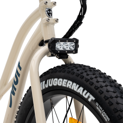 Close-up of a bicycle with The Fat Murf Step-Thru's rugged front led light fixture. 