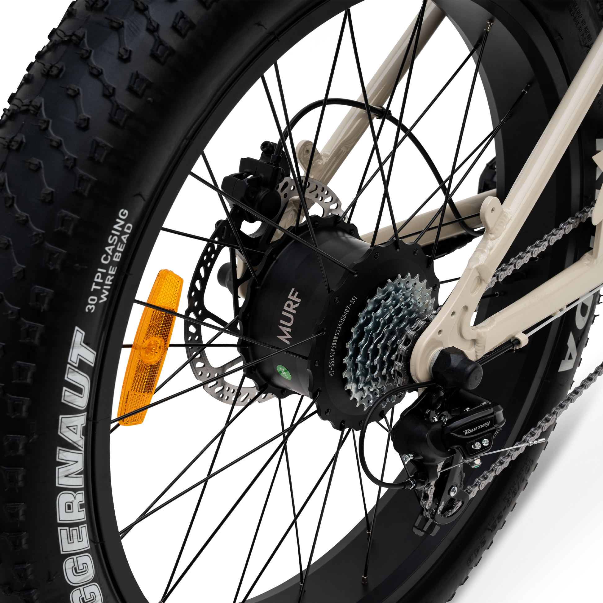 Close-up of a bicycle wheel with gear chain and rear hub motor mechanism on a white background