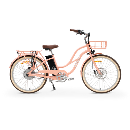 The Gigi step-thru electric cruiser bike in Beach Peach shown from the side in a studio view