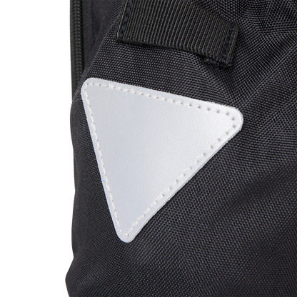 Close-up detail of the highly visible, stitched reflective safety triangle patch on the Murf Big Dawg Rack Bag.