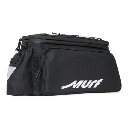 Murf Big Dawg Rack Bag product photo, black with white "MURF" logo, showing the main compartment and a side pocket with reflective triangle.