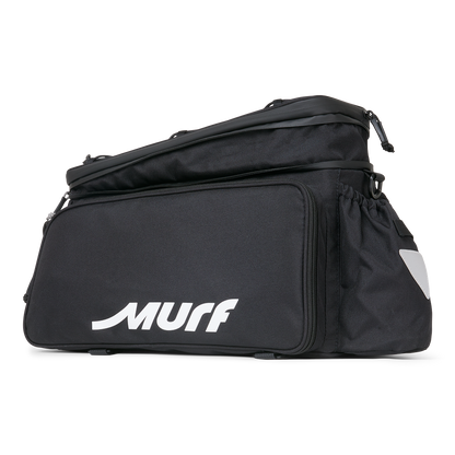 Side view of the Murf Big Dawg Rack Bag, featuring the main zipped compartment, the cinch-down side pocket, and the reflective safety triangle.