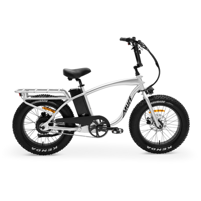 The Higgs  fat tire e-bike in raw polished aluminum frame, shown from side  in a studio view.