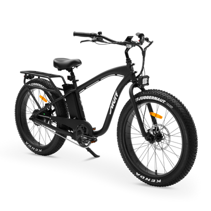 A three-quarters studio view of The Alpha Murf fat tire e-bike, highlighting its frame and handlebars.