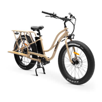 Desert Sand Gloss Alpha Cargo Class 2 Electric Utility Bike three-quarter studio view with bamboo platform

