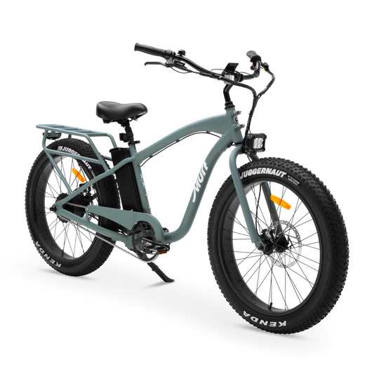 The Alpha Murf fat tire electric bike in Seabreeze Green, shown from the side in a studio view.