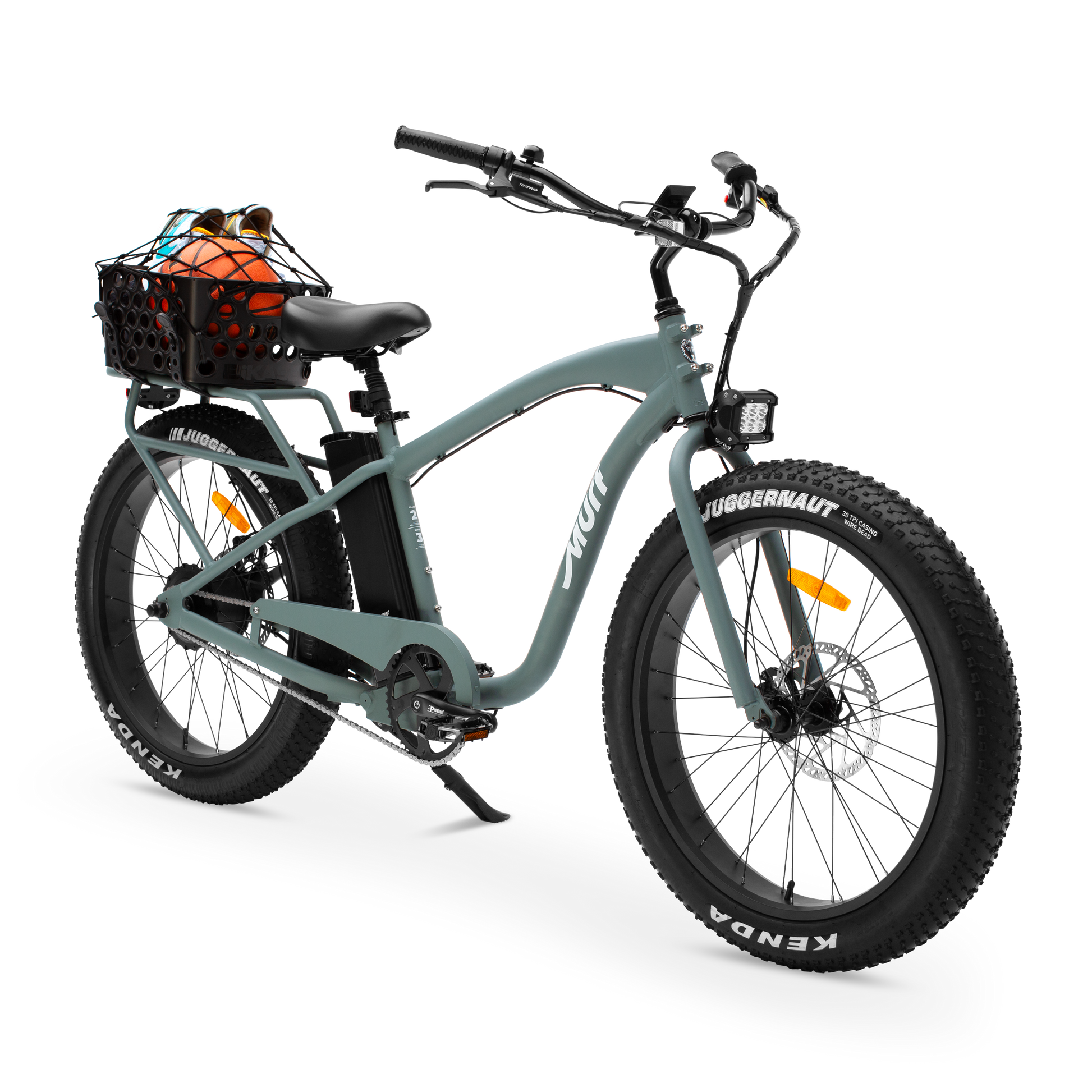 Sea Breeze Green electric bike with a basket filled with rear basket ball and pair of shoes on a white background