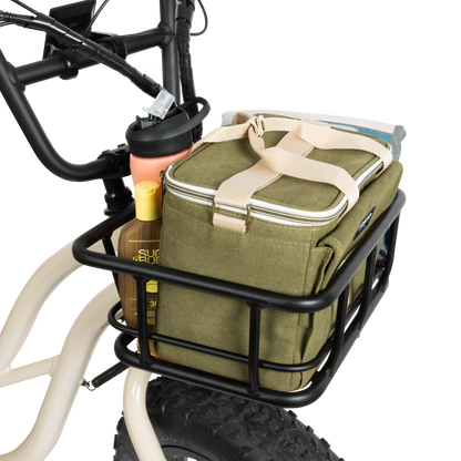 Front Basket mounted on a white e-bike and loaded with a cooler bag, water bottle, and sunscreen, demonstrating the ample cargo capacity for recreation and utility.