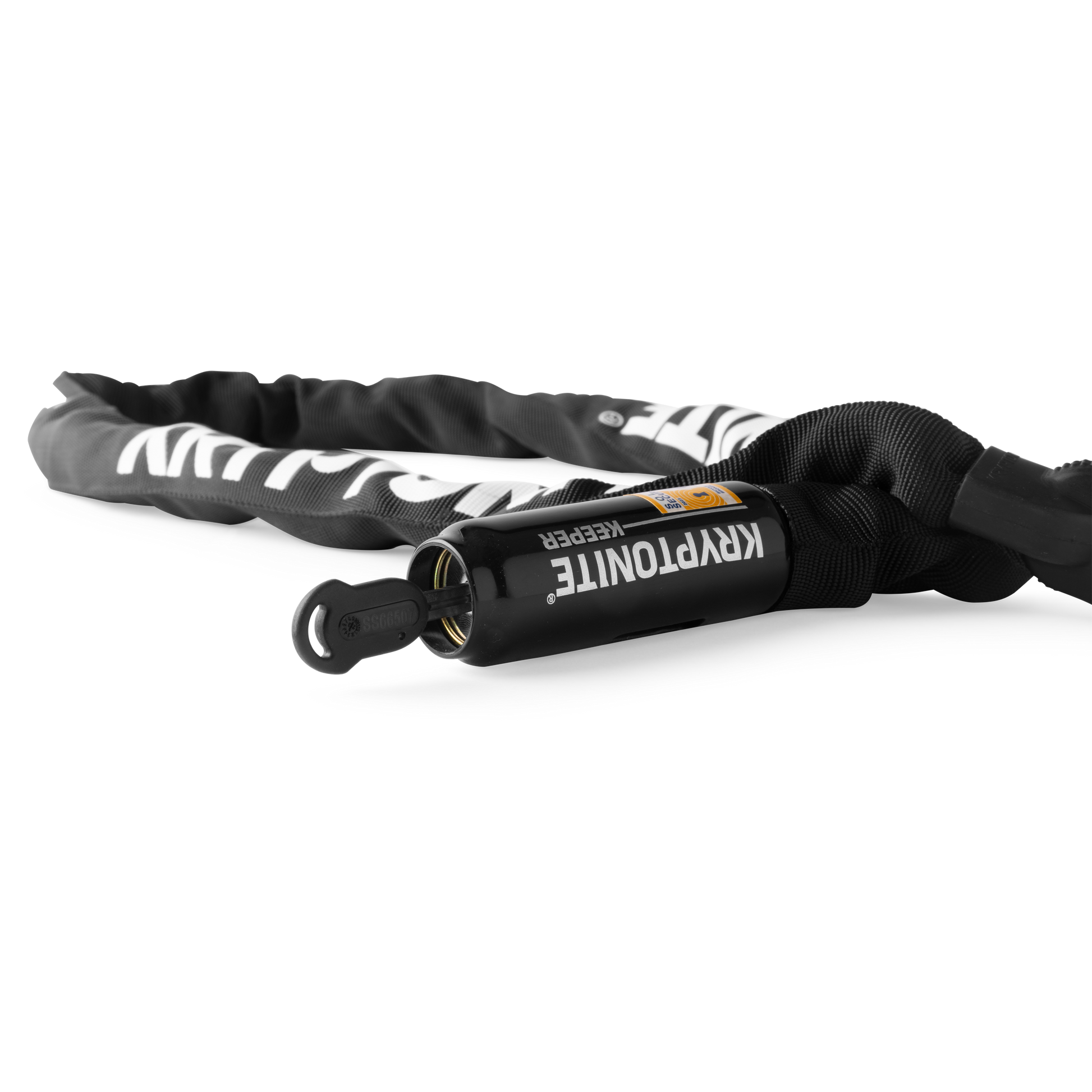 The Kryptonite Keeper chain lock head in a horizontal close-up, featuring the high-security disc-style cylinder, with one of the ergonomic "I" keys inserted into the lock.