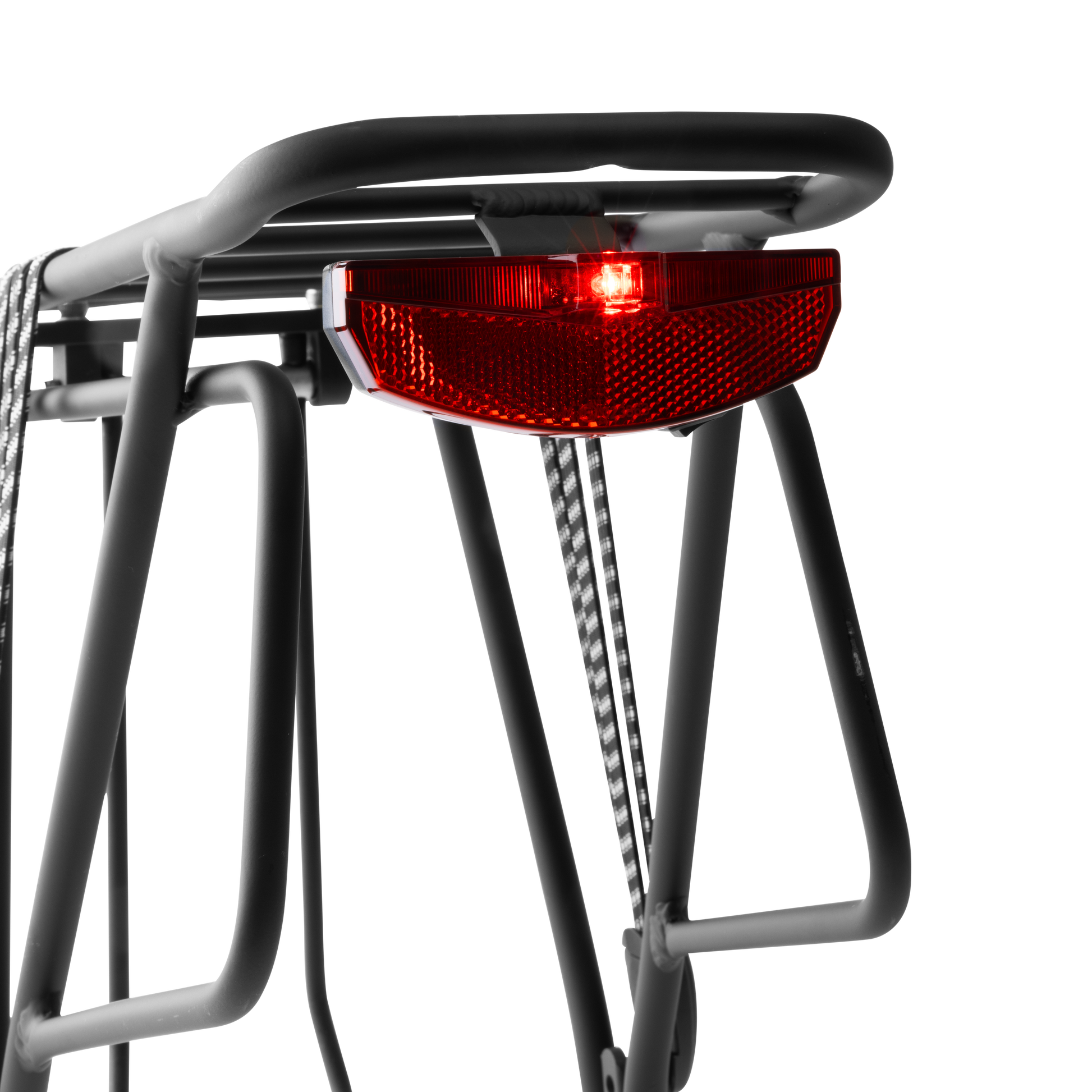 Close-up view of the Murf Rear Rack's integrated rear tail light, showing the bright red LED illuminated for visibility and road safety.