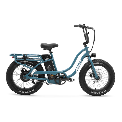 The Higgs ST step-thru fat tire e-bike in Denim Blue, shown from three quarter in a studio view.
