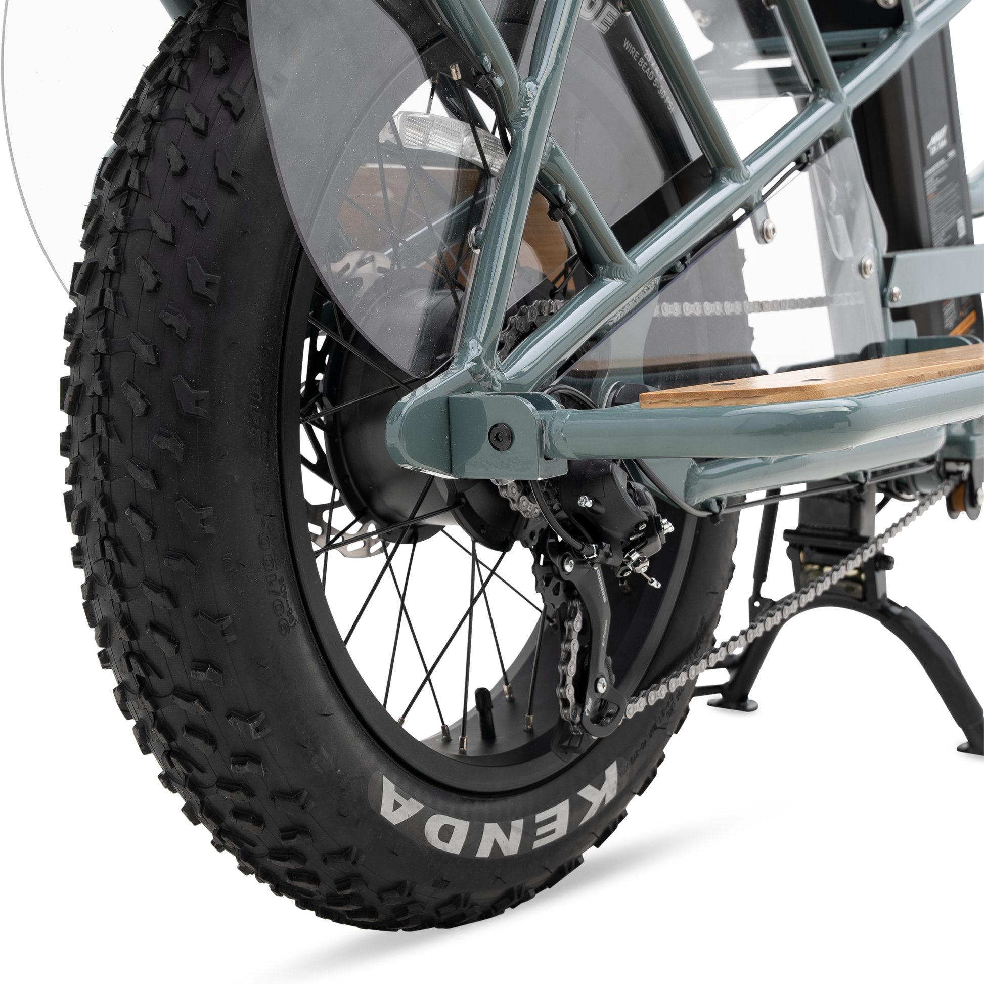 Protective wheel skirt and bamboo deck detail separating passenger from rear wheel