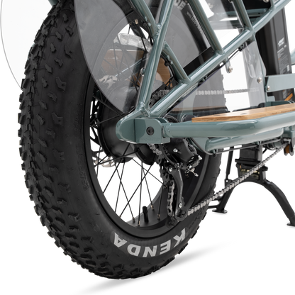 Protective wheel skirt and bamboo deck detail separating passenger from rear wheel