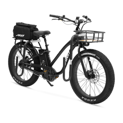 The Alpha ST e-bike shown with optional accessories, including a front basket and rear pannier bags.