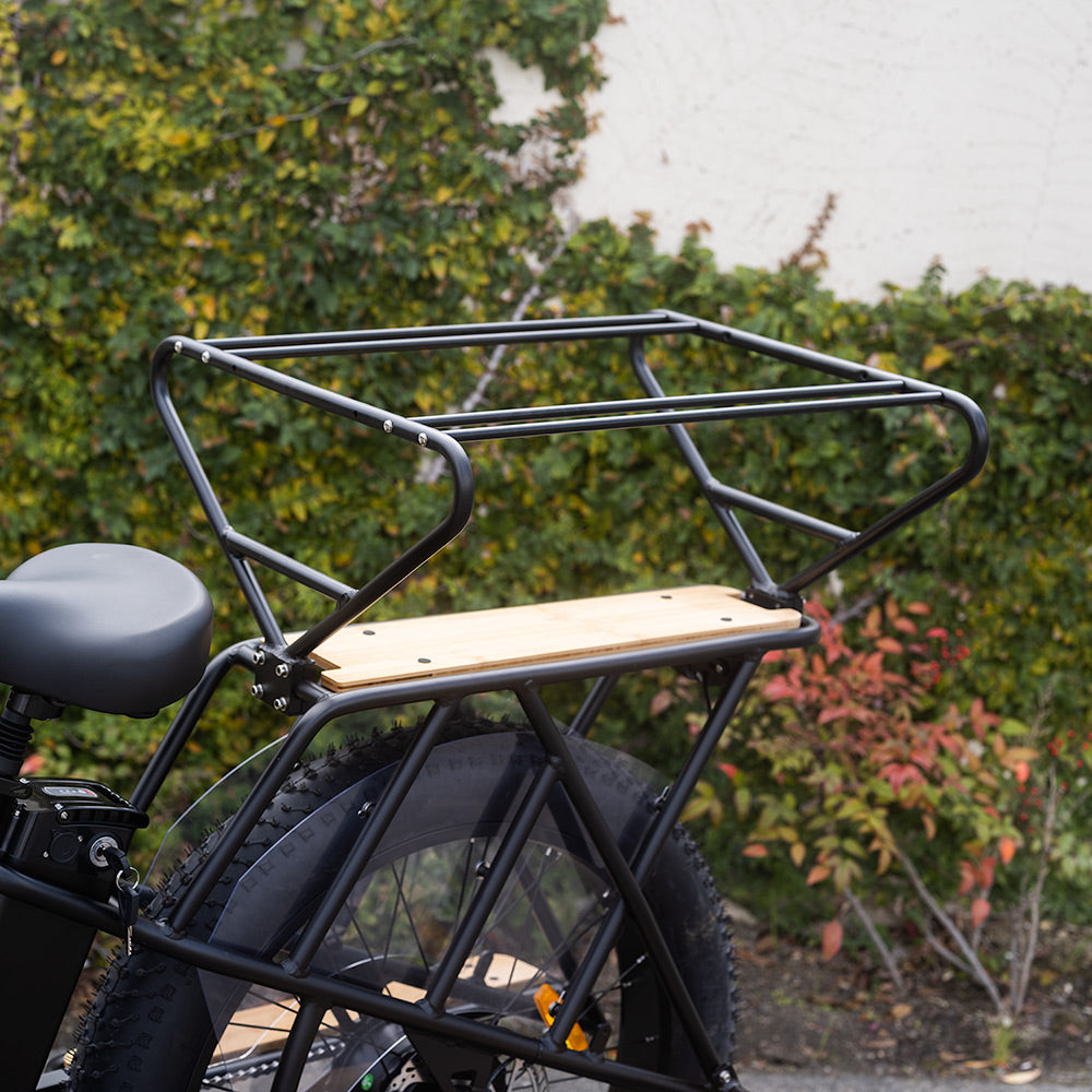 Studio shot of the Murf Cargo Carriage assembly, black powder-coated aluminum, mounted over the wood rear rack of a Murf e-bike. This visual emphasizes the Universal-Bracket installation.